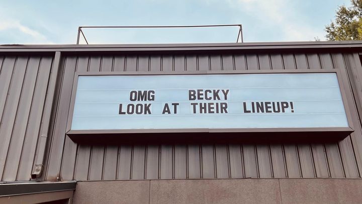 Marquee with the words OMG BECKY LOOK AT THEIR LINEUP! on it.